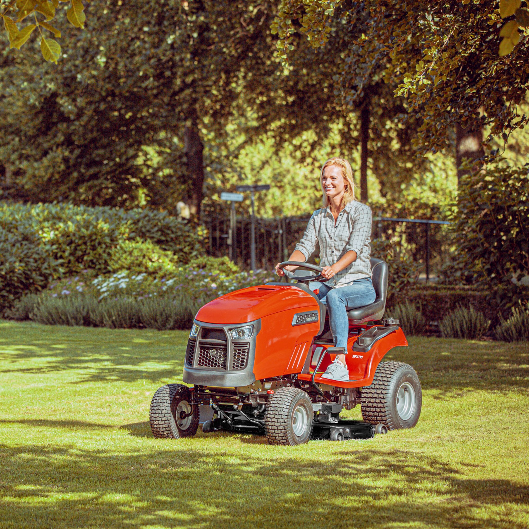 5lym2s0fbw1.jpg - Mowers Online Man riding red lawn mower on grass