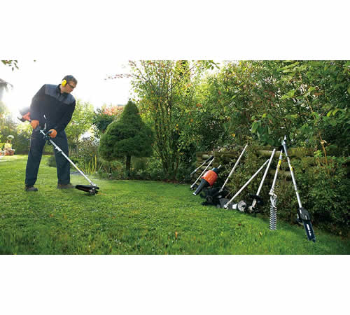 dlm4pwuyw2h.jpg - Mowers Online Man using string trimmer with landscaping tools