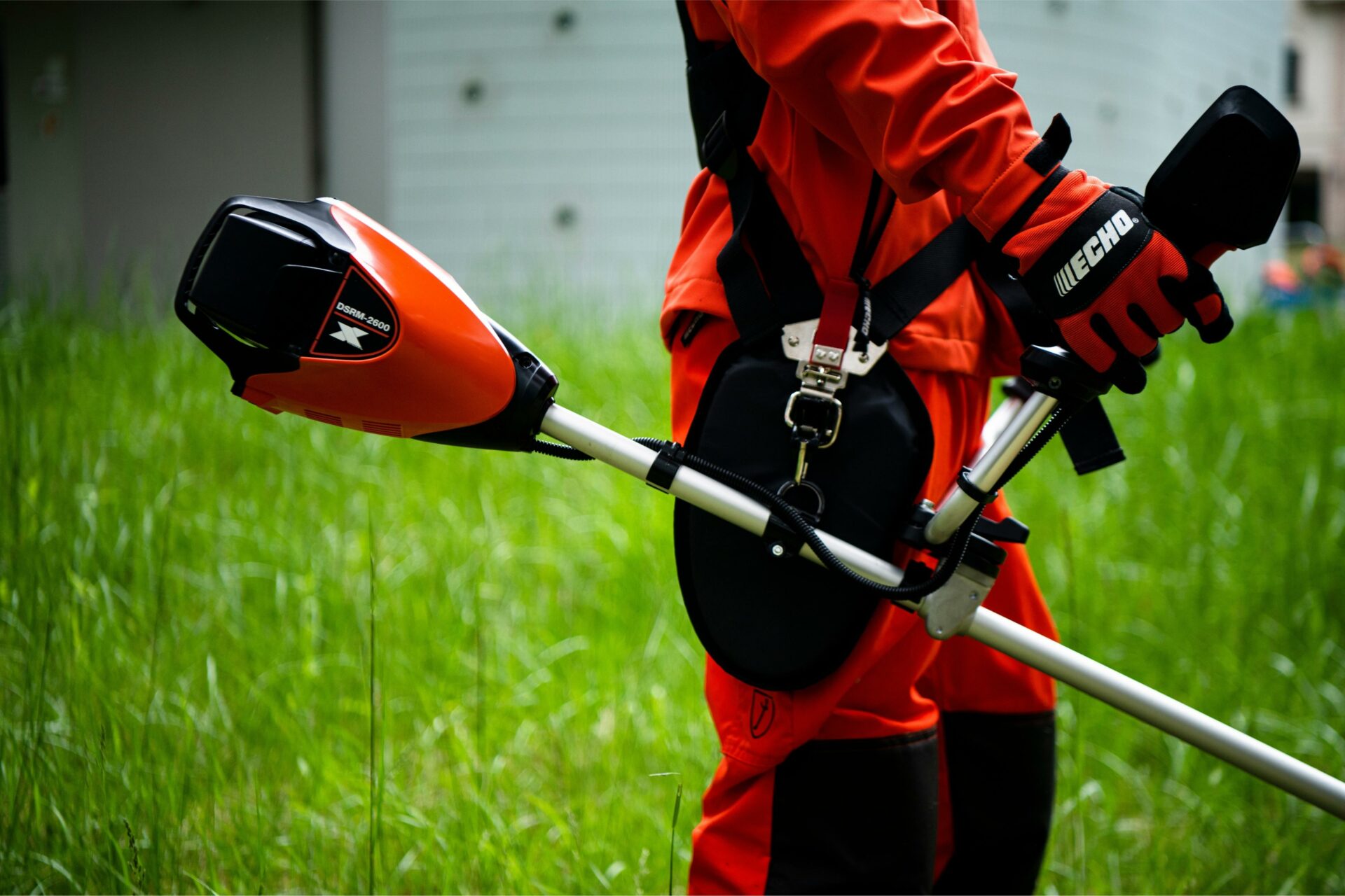 e1u4onffzj1.jpg - Mowers Online Person holding kayak paddle with orange blade