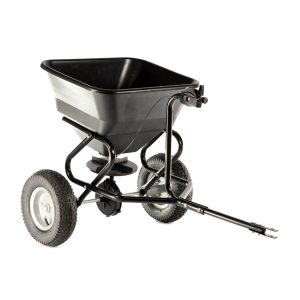 Tow-behind broadcast spreader with pneumatic tires