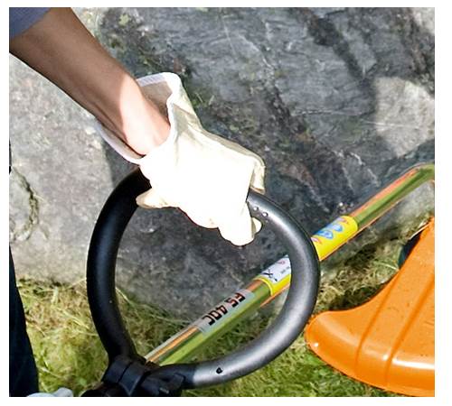 pf01bygehbp.jpg - Mowers Online Person cleaning bicycle handlebar with cloth