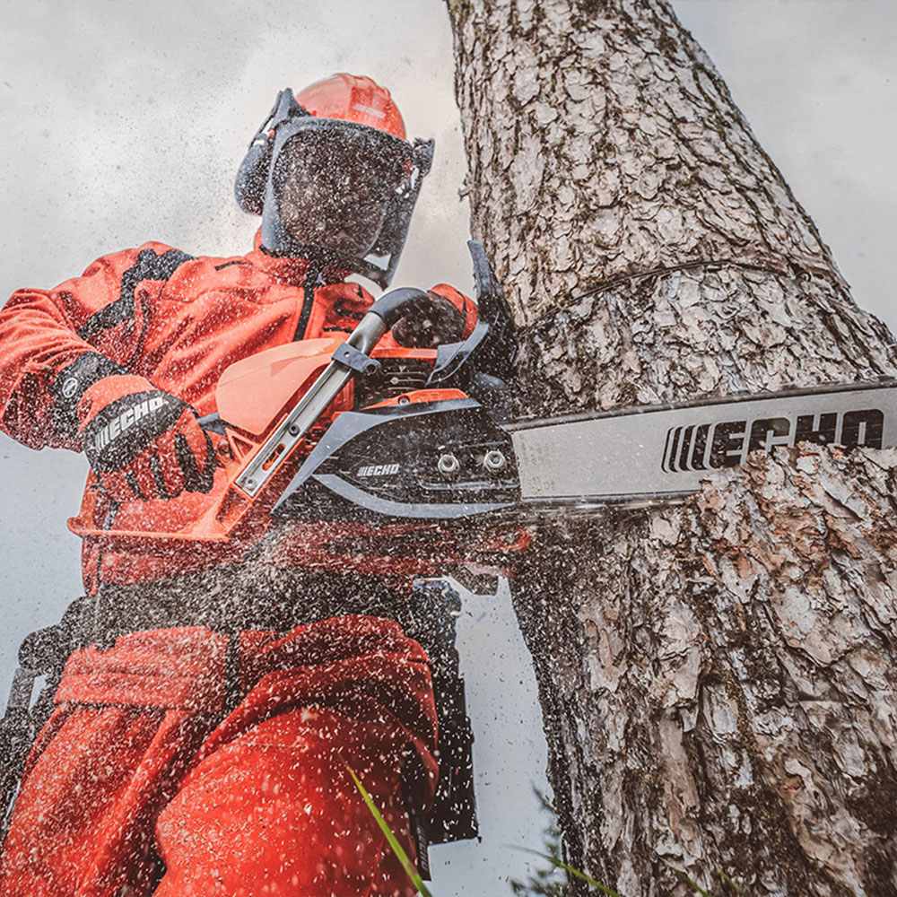 s4xooet5am1.jpg - Mowers Online Arborist using chainsaw to fell tree