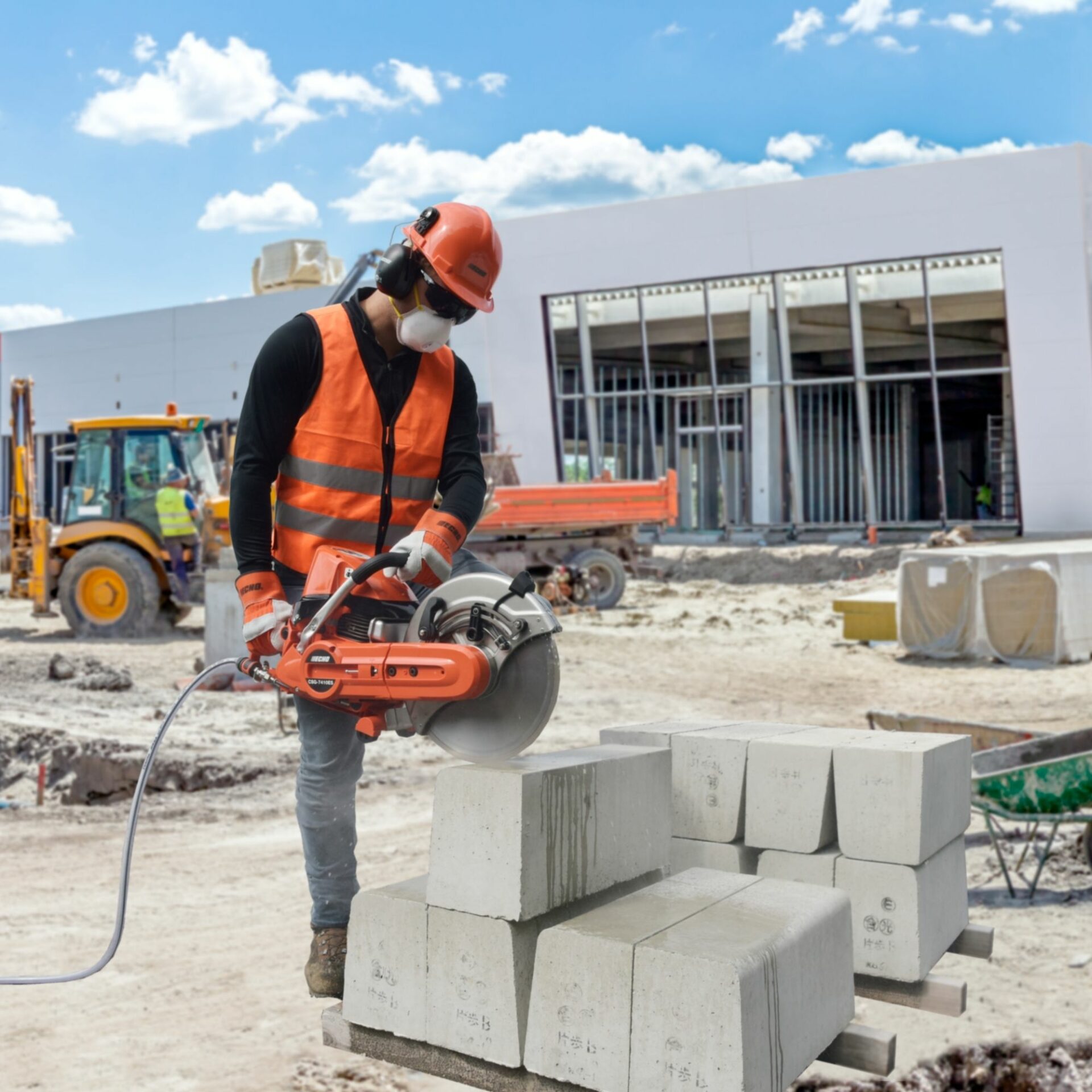 s5t2s42g1cg.jpg - Mowers Online Worker operating handheld concrete breaker on job site