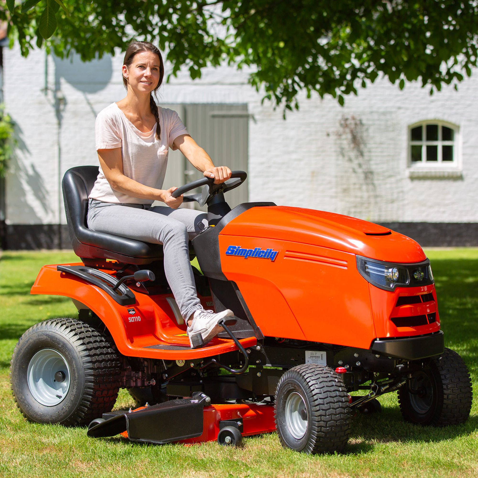 y3gbszrqliy.jpg - Mowers Online Woman on orange riding lawn mower